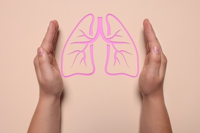 Image of Woman holding hands near illustration of lungs on dark beige background, closeup. Asthma and other respiratory diseases