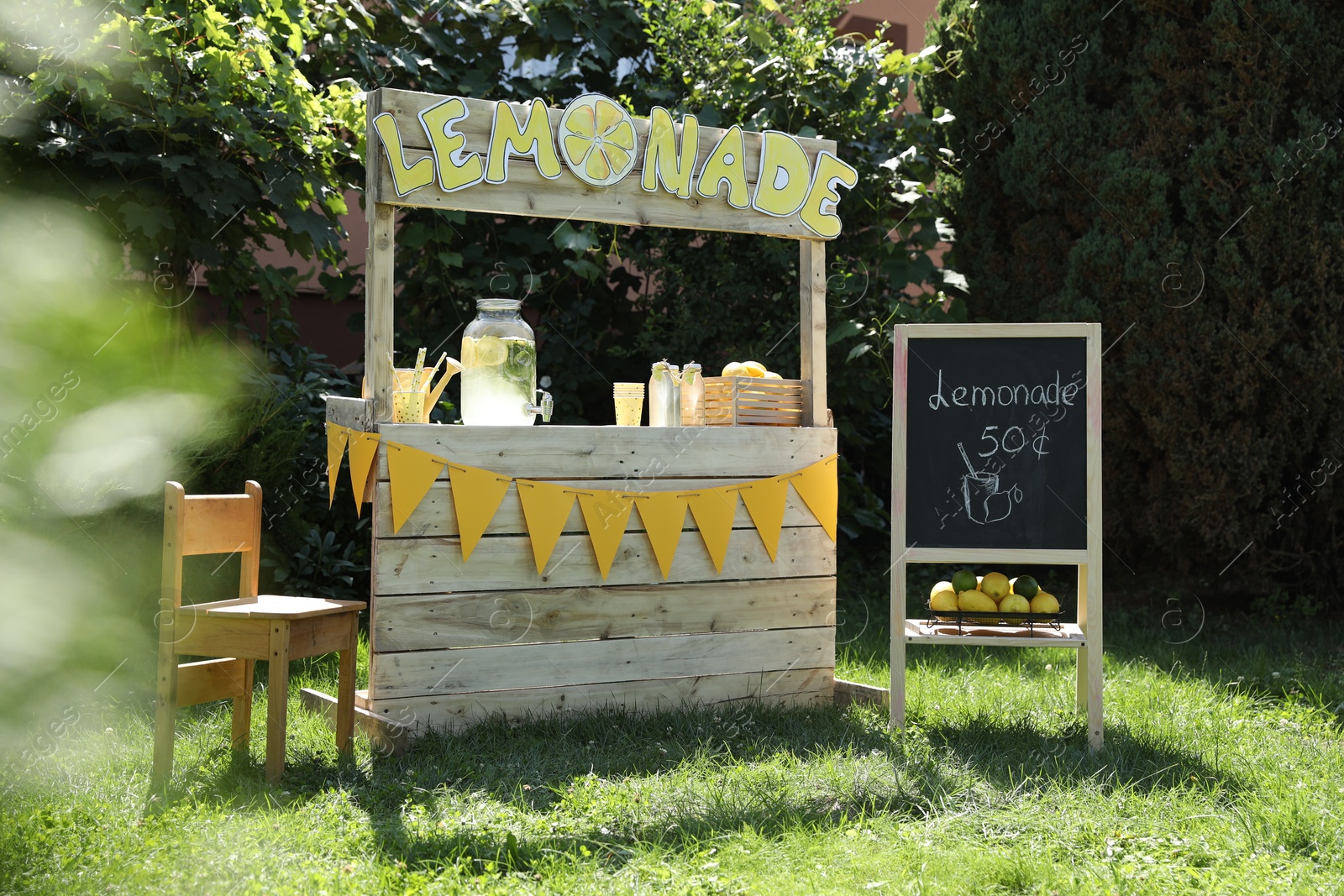 Photo of Lemonade stand with refreshing drink in park