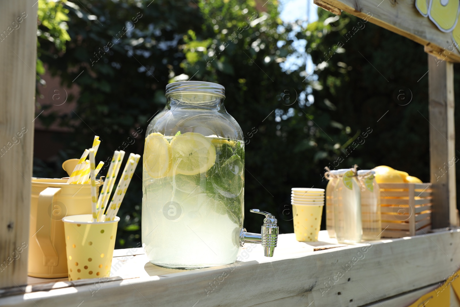 Photo of Lemonade stand with refreshing drink in park