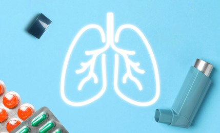 Image of Asthma inhaler, drugs and illustration of lungs on light blue background, flat lay