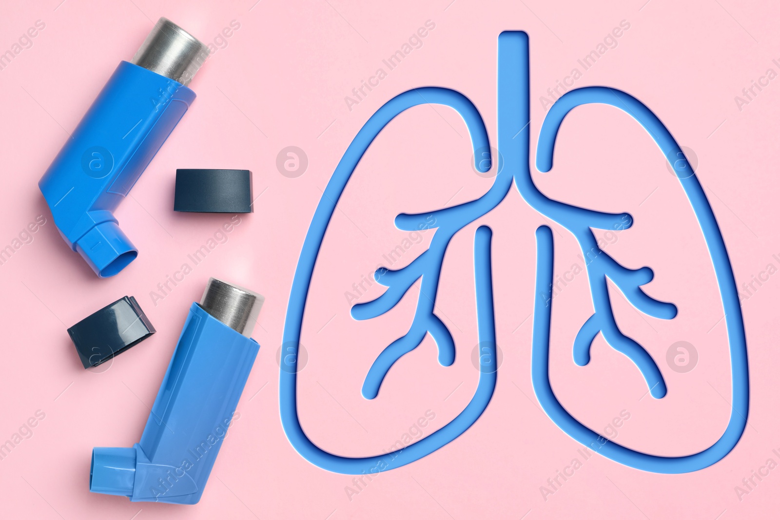 Image of Asthma inhalers and illustration of lungs on pink background, top view