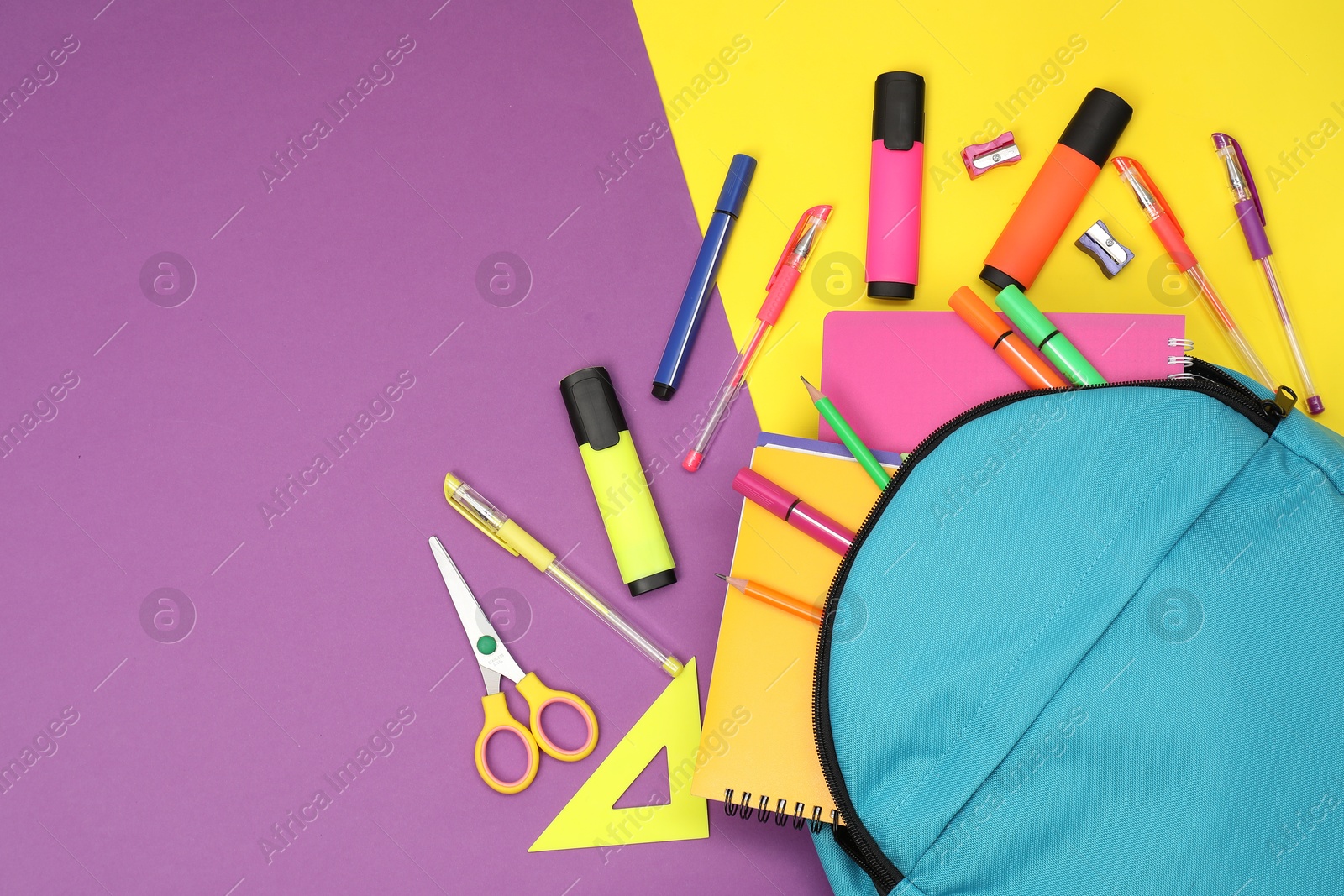 Photo of Flat lay composition with backpack and different school stationery on color background, space for text