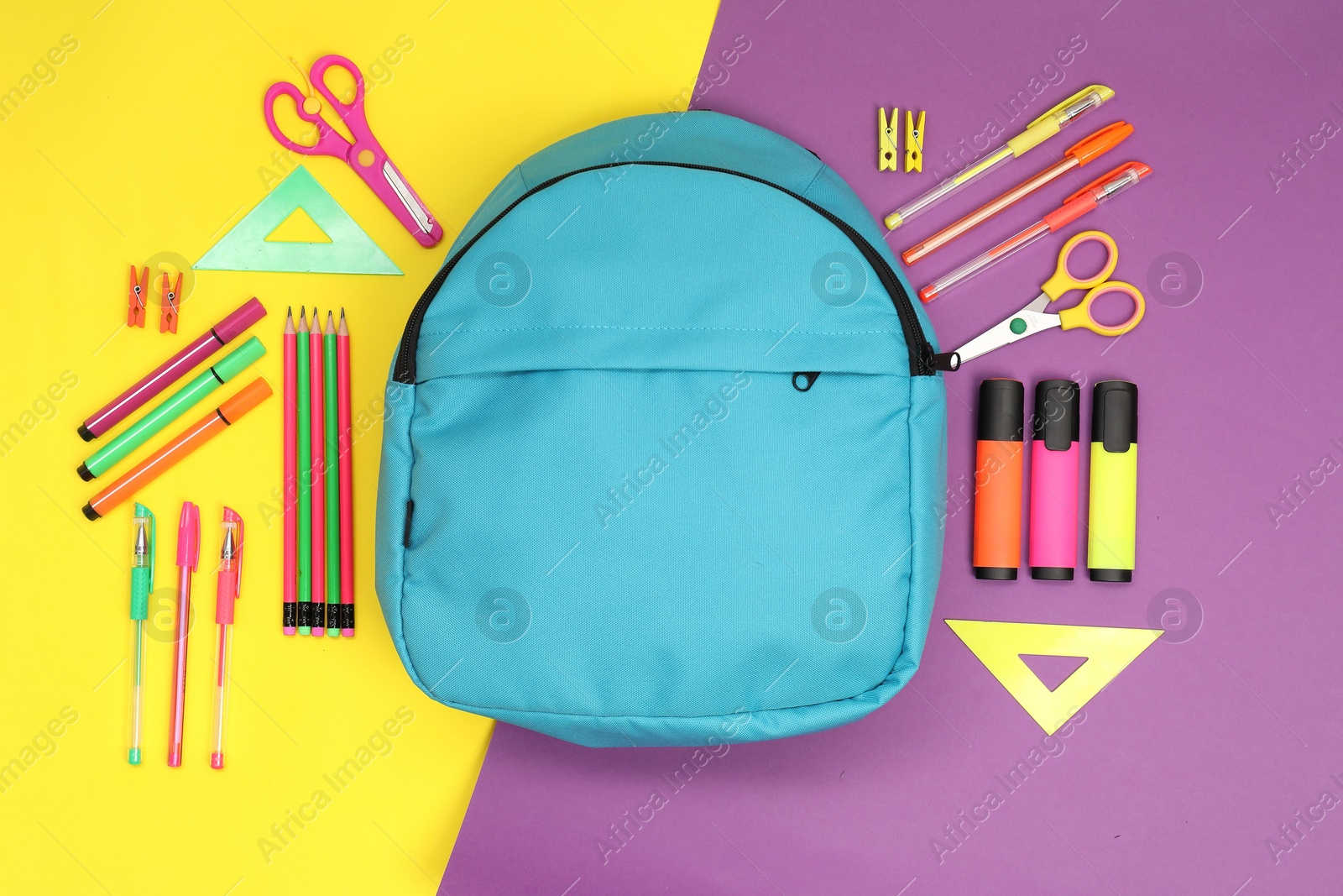 Photo of Flat lay composition with backpack and different school stationery on color background