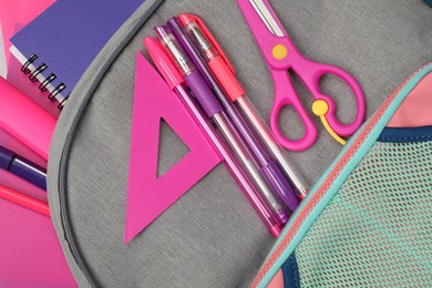 Photo of Flat lay composition with backpack and different school stationery on table