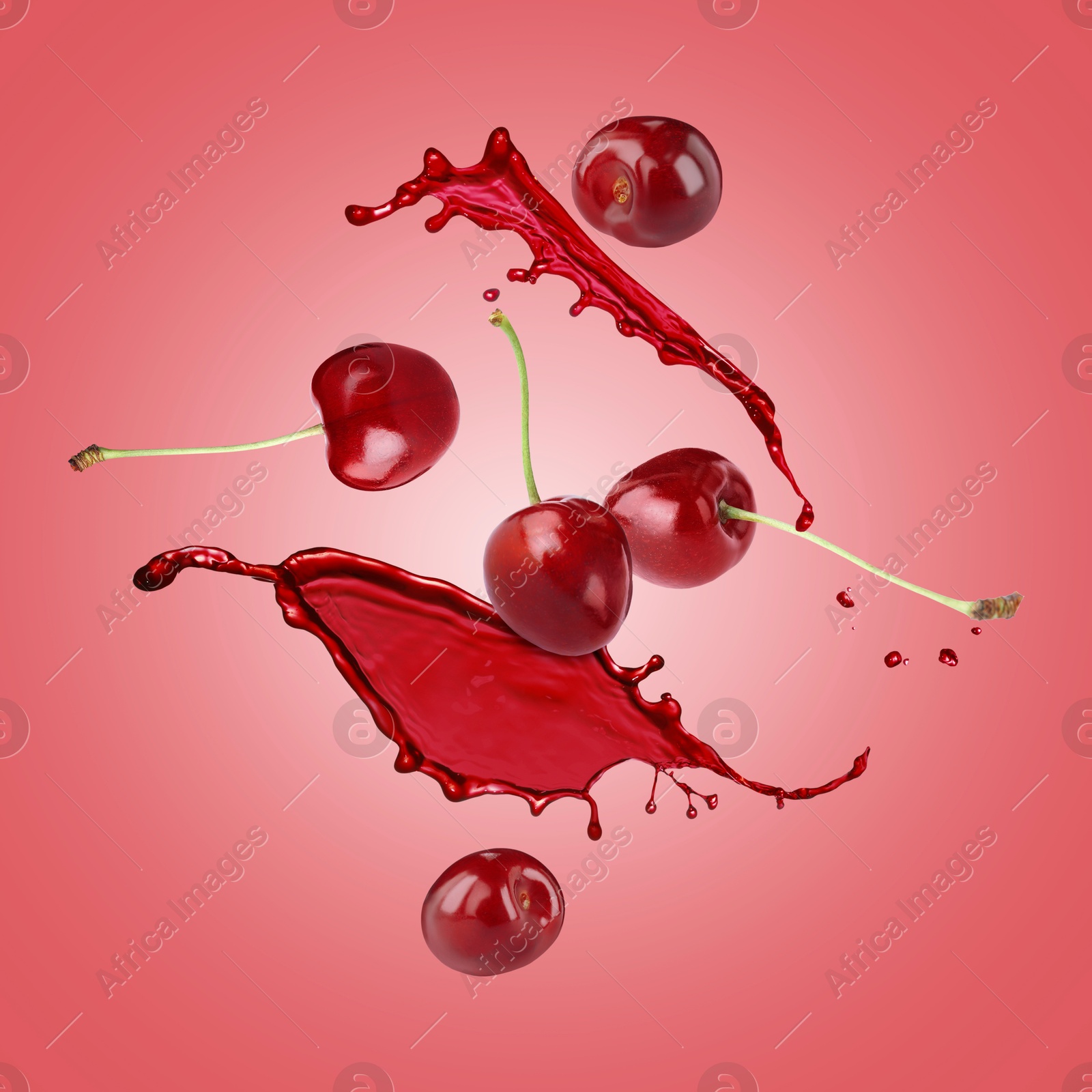 Image of Juice splashes and fresh cherries in air on red background