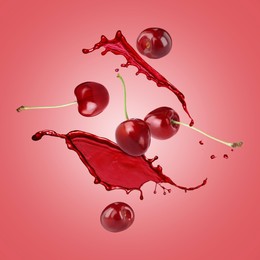 Image of Juice splashes and fresh cherries in air on red background