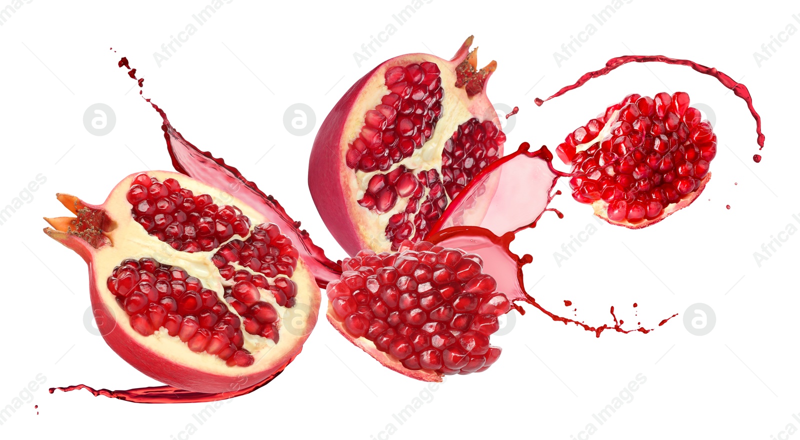 Image of Juice splashes and fresh pomegranates in air on white background