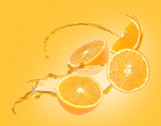 Image of Juice splashes and fresh oranges in air on golden background