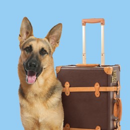 Image of Cute German Shepherd dog and leather suitcase on light blue background