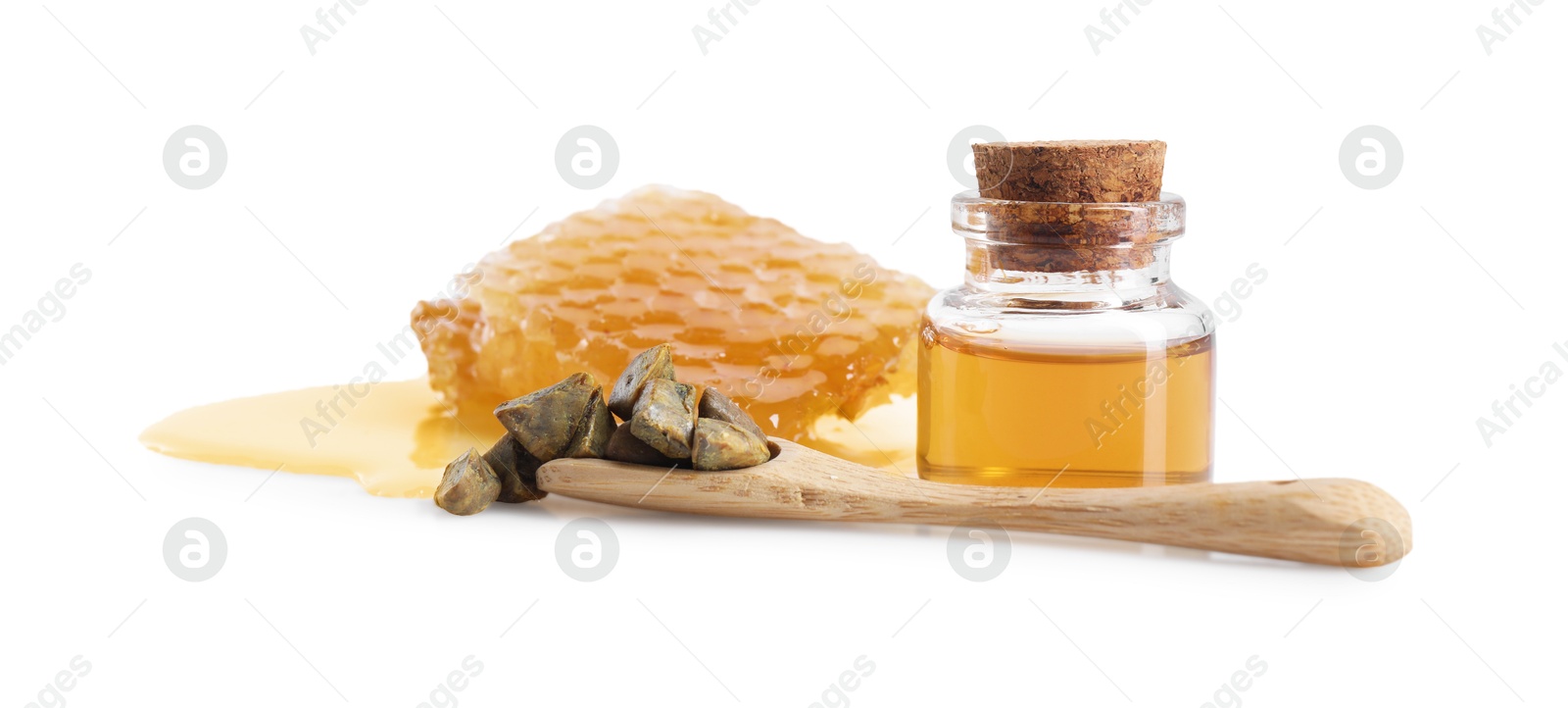 Photo of Natural honey tincture, propolis granules and sweet honeycomb isolated on white