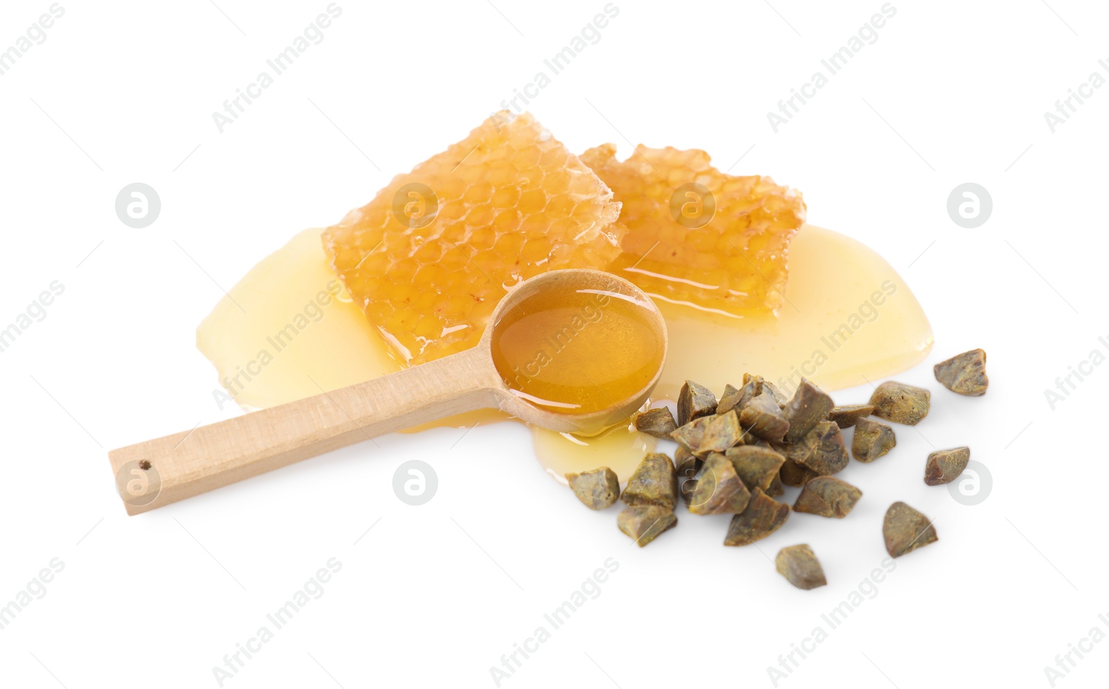 Photo of Sweet honeycombs and propolis granules isolated on white