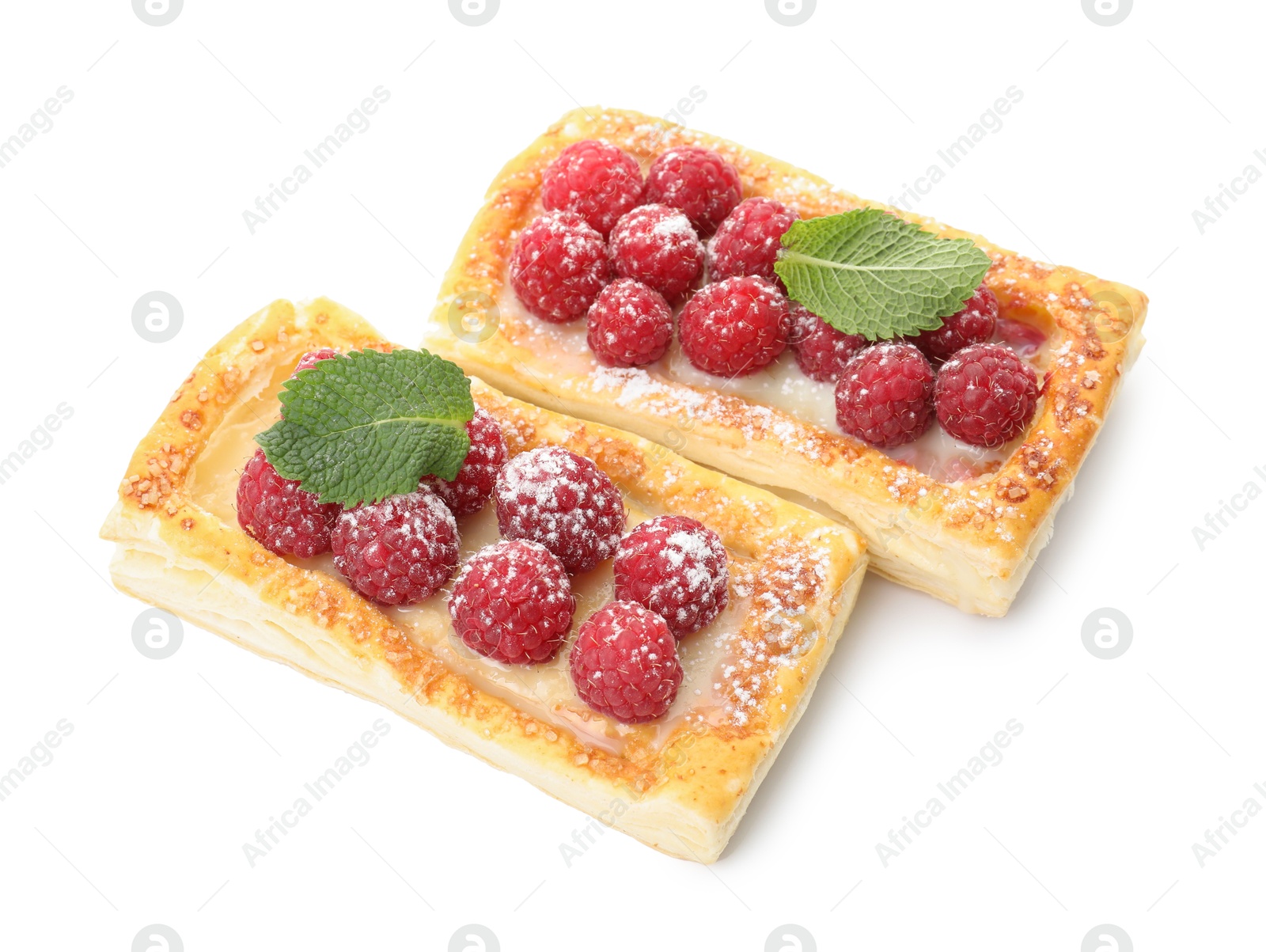 Photo of Tasty puff pastries with raspberries and mint isolated on white