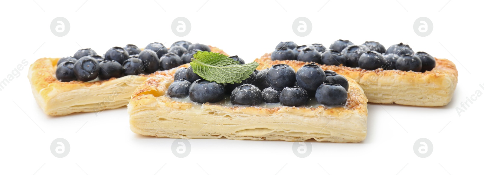 Photo of Tasty puff pastries with blueberries isolated on white