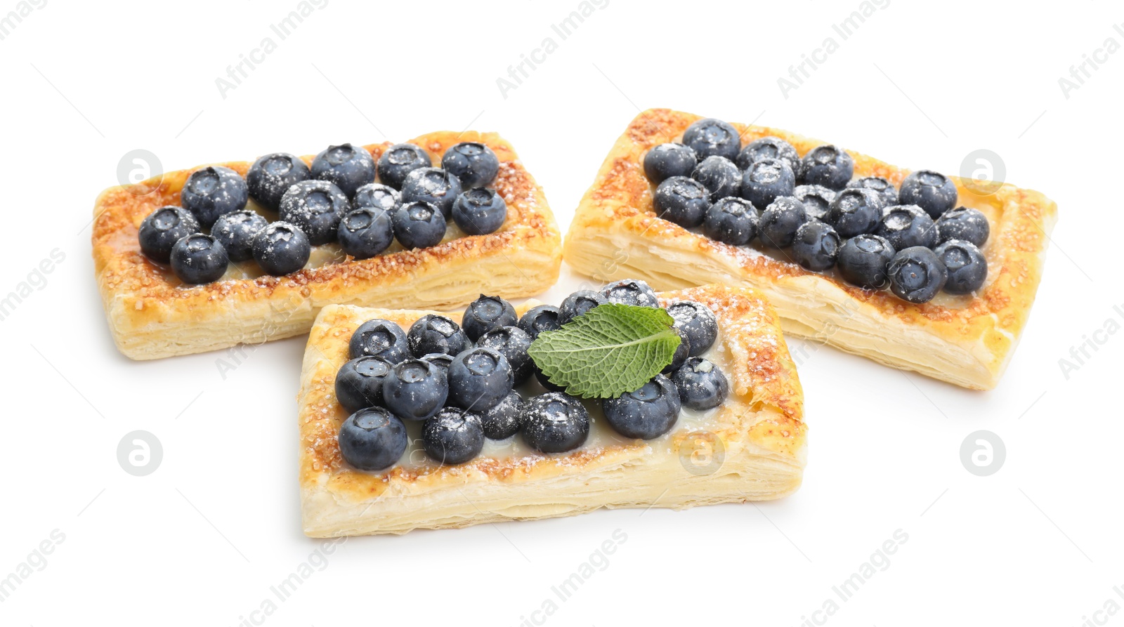 Photo of Tasty puff pastries with blueberries isolated on white