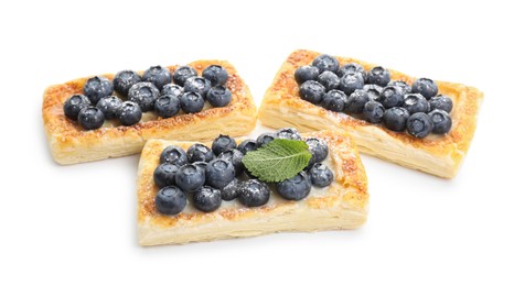 Photo of Tasty puff pastries with blueberries isolated on white