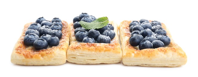 Photo of Tasty puff pastries with blueberries isolated on white