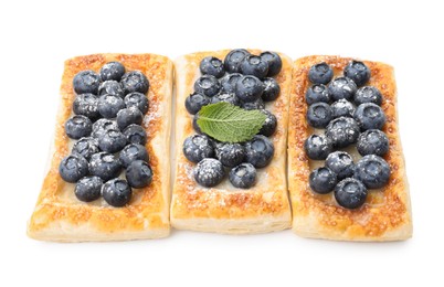 Photo of Tasty puff pastries with blueberries isolated on white