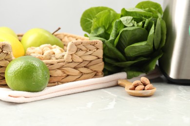 Healthy products prepared for blending on grey marble table, closeup