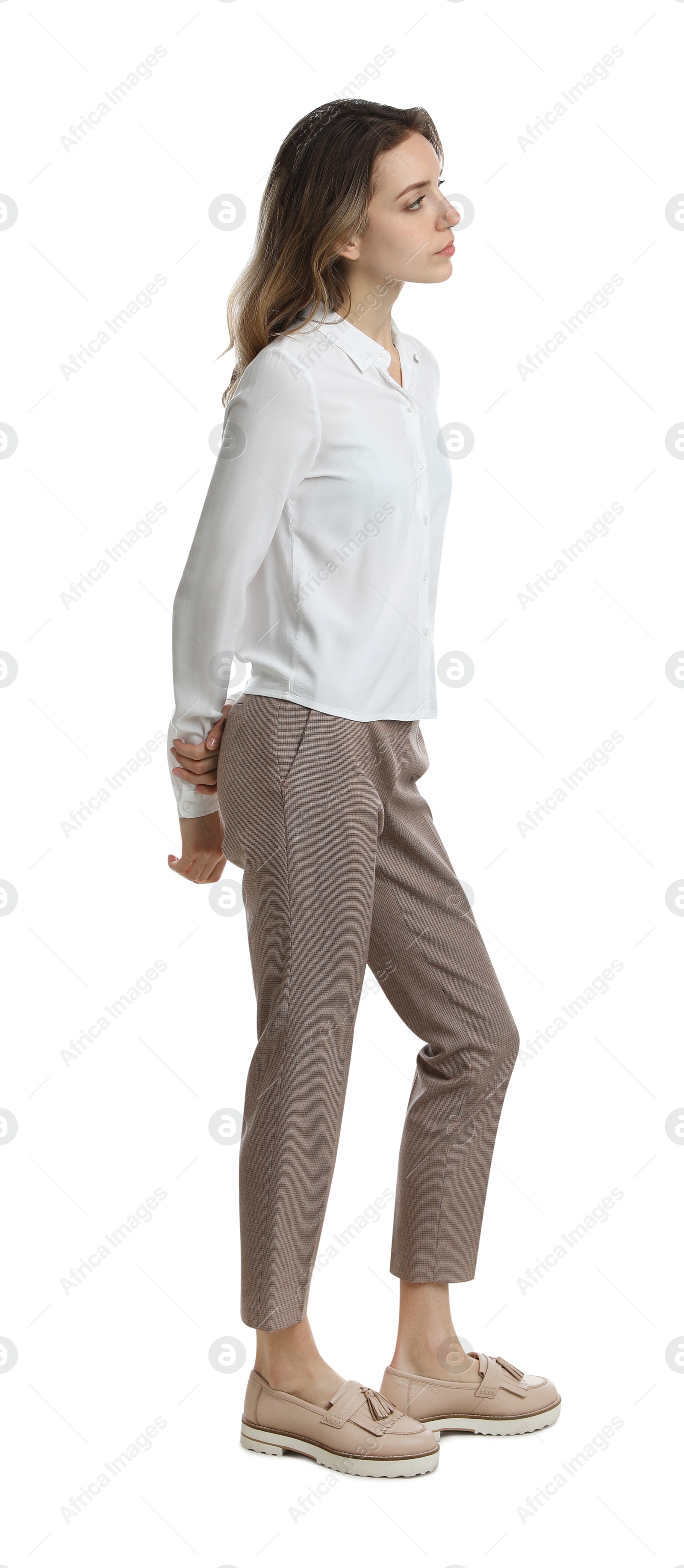 Photo of Young woman in casual outfit on white background