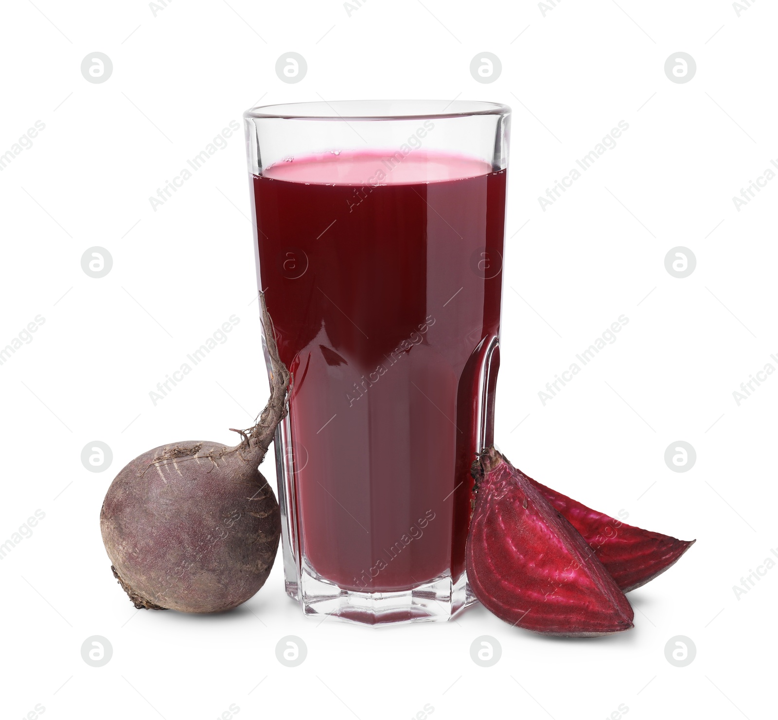 Photo of Fresh beet juice in glass and ripe vegetables isolated on white