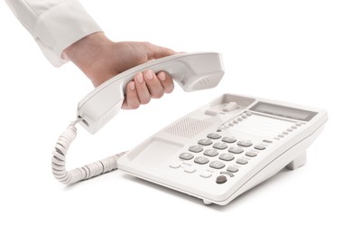 Photo of Woman taking handset of telephone on white background, closeup