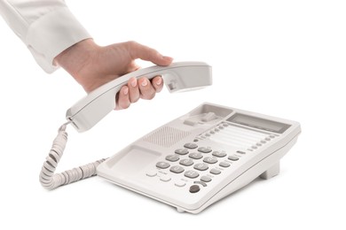 Woman taking handset of telephone on white background, closeup