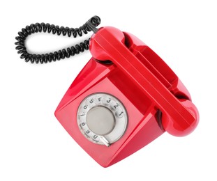 Photo of One red telephone with handset isolated on white, top view