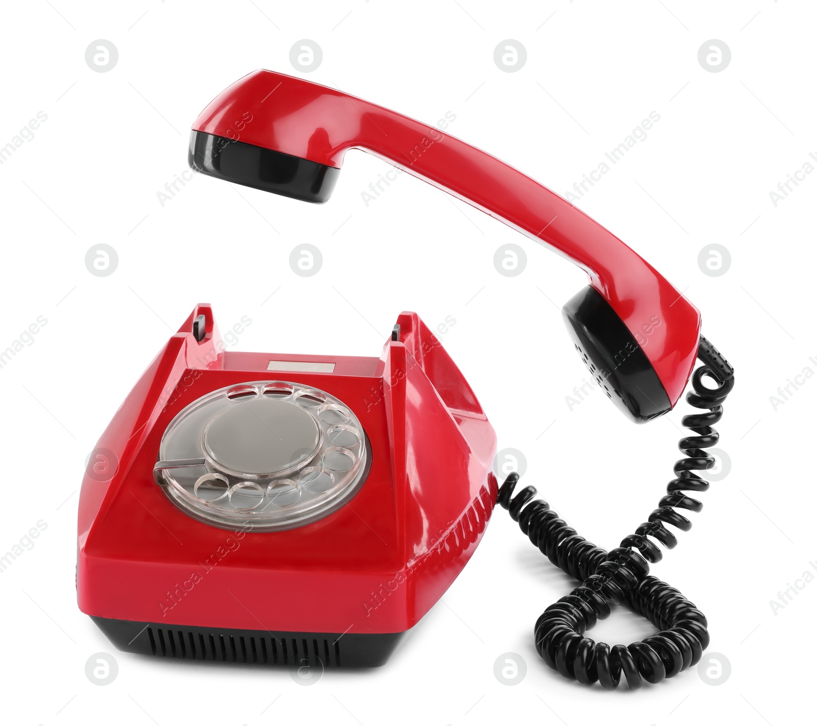 Photo of One red telephone with handset isolated on white