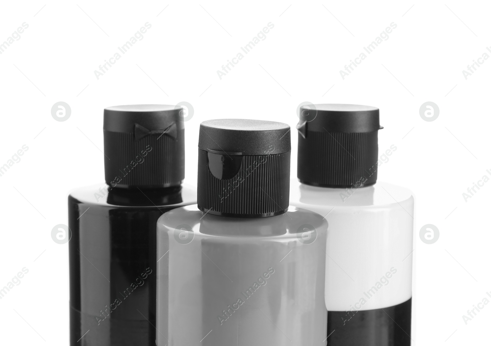 Photo of Acrylic paints of different colors in bottles isolated on white