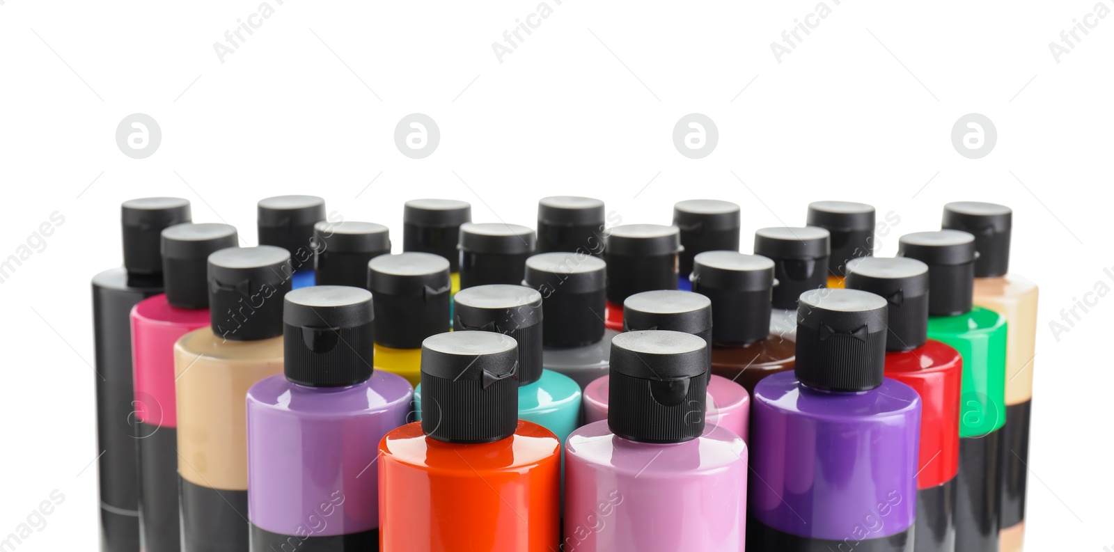 Photo of Acrylic paints of different colors in bottles isolated on white