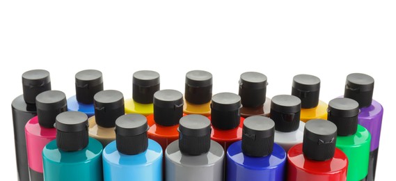 Photo of Acrylic paints of different colors in bottles isolated on white