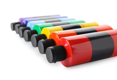 Photo of Acrylic paints of different colors in bottles isolated on white