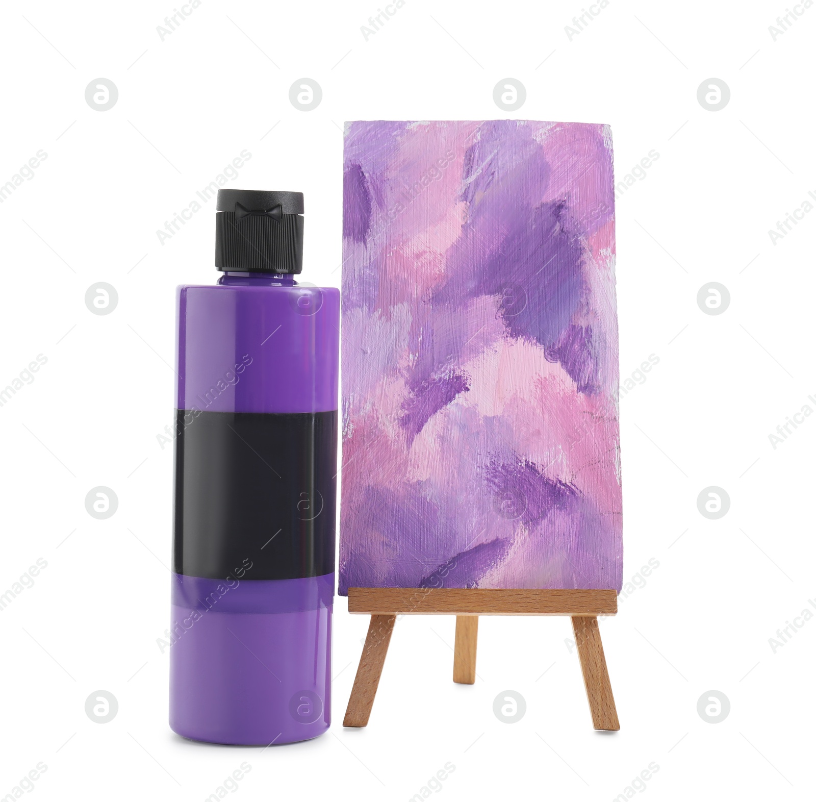 Photo of Purple acrylic paint in bottle and small easel with abstract picture isolated on white