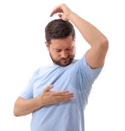 Emotional man in t-shirt before using deodorant on white background