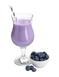 Photo of Tasty yogurt in glass and fresh blueberries isolated on white