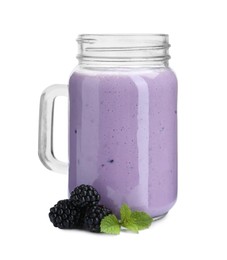 Tasty yogurt in glass, fresh blackberries and mint isolated on white