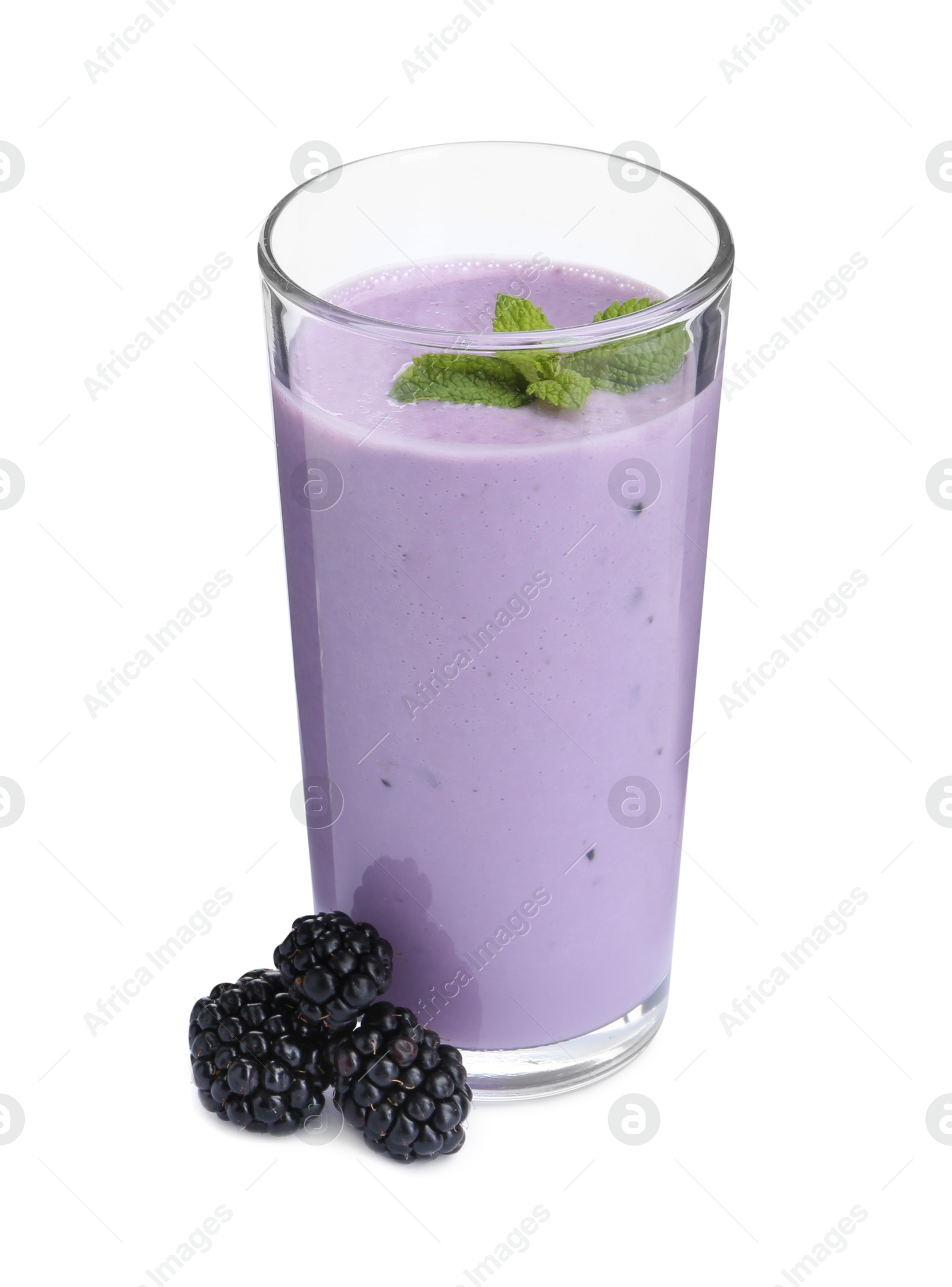 Photo of Tasty yogurt in glass and fresh blackberries isolated on white