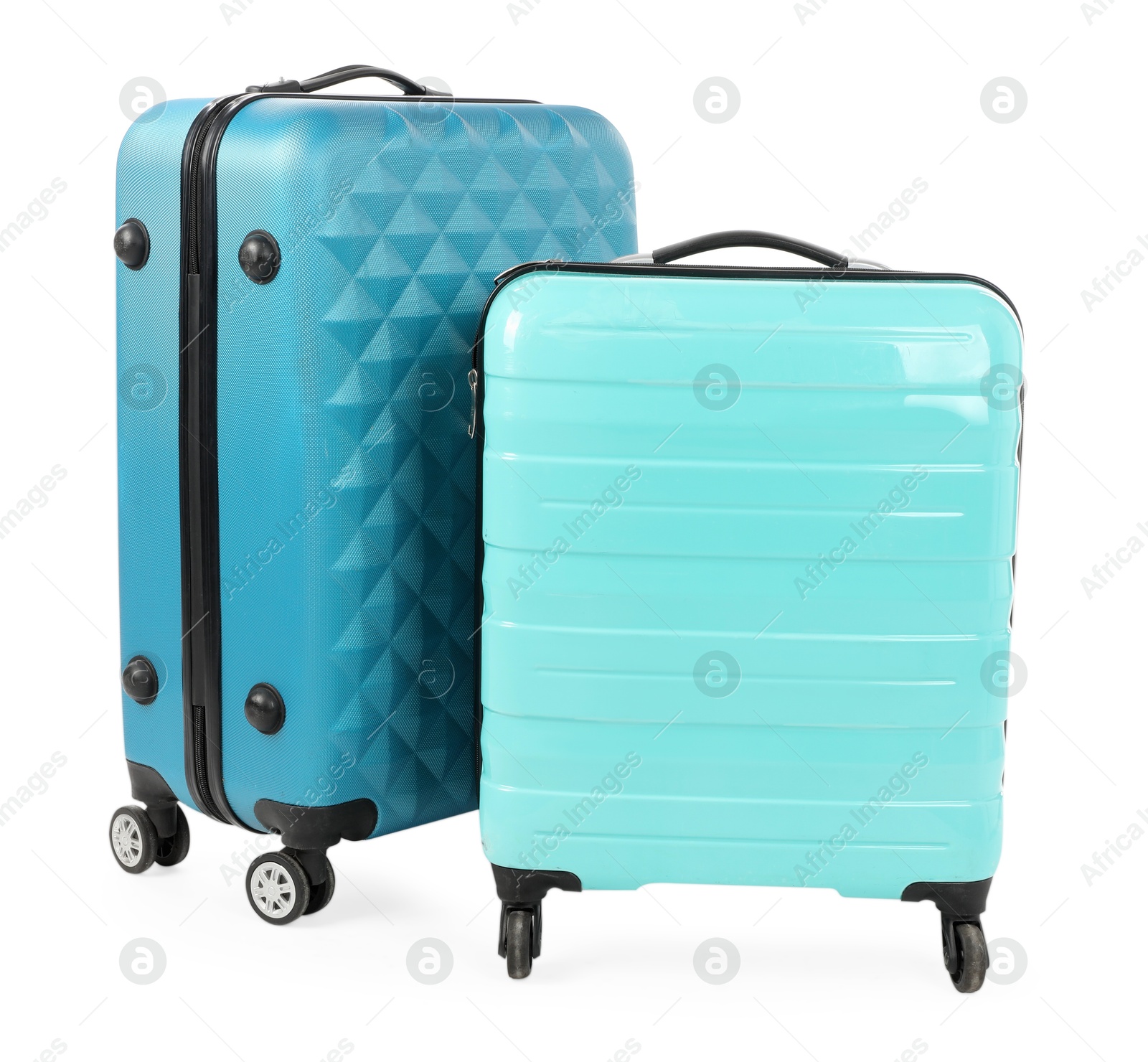 Photo of Two new light blue suitcases isolated on white