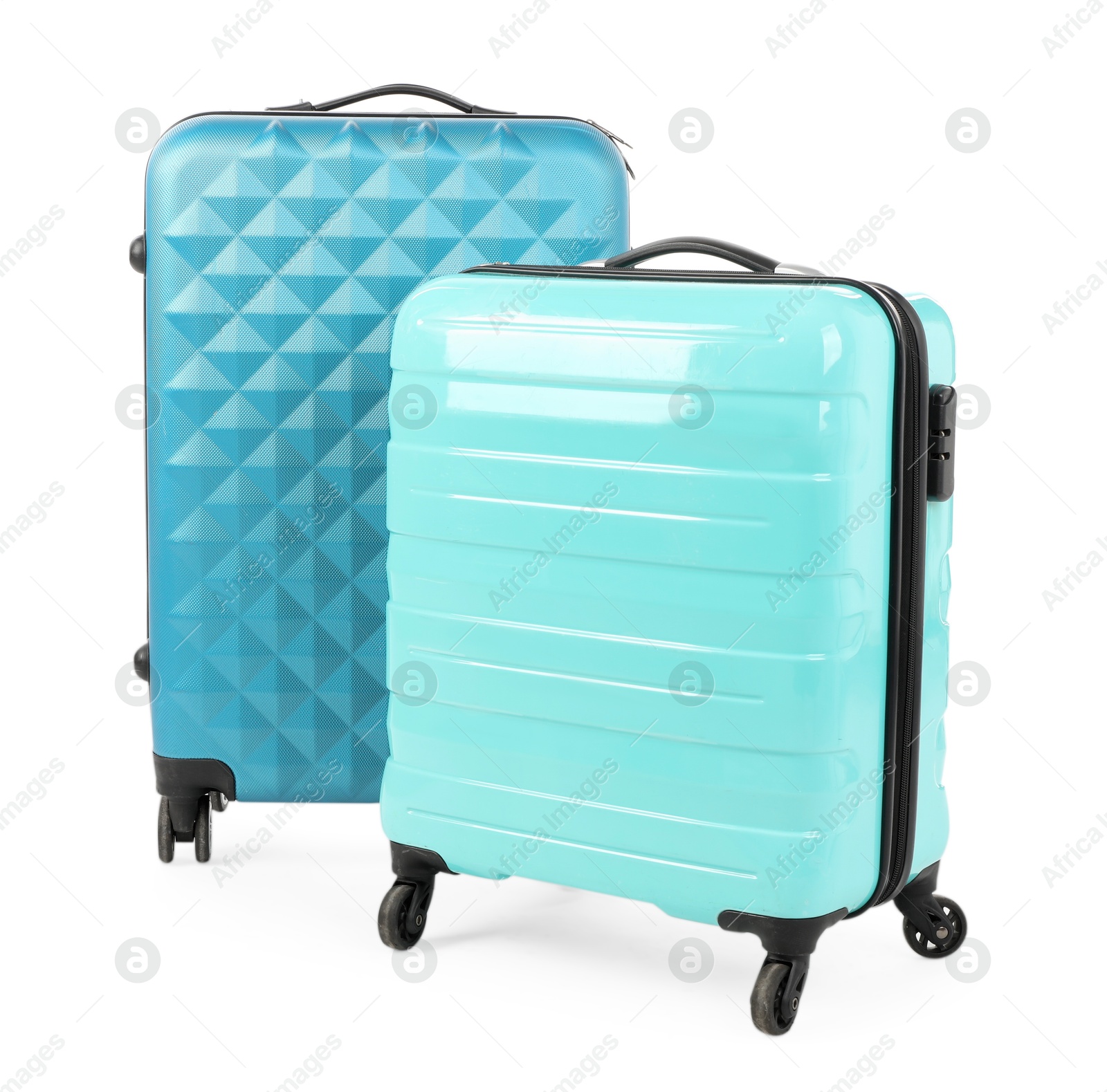 Photo of Two new light blue suitcases isolated on white