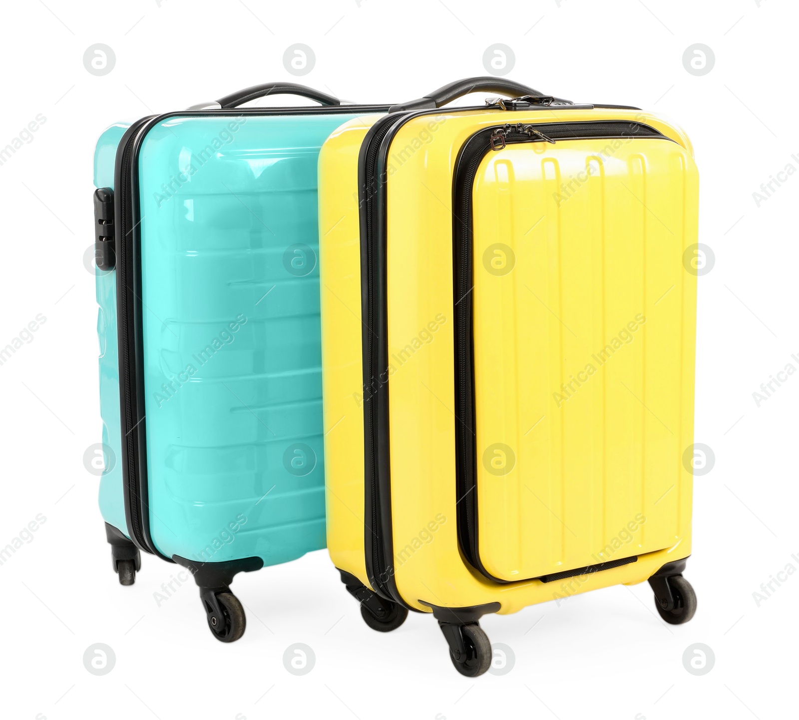 Photo of Two new yellow and light blue suitcases isolated on white