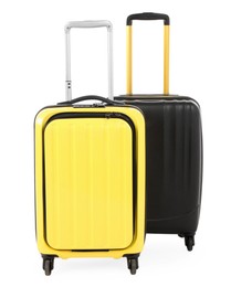 Photo of Two new yellow and black suitcases isolated on white