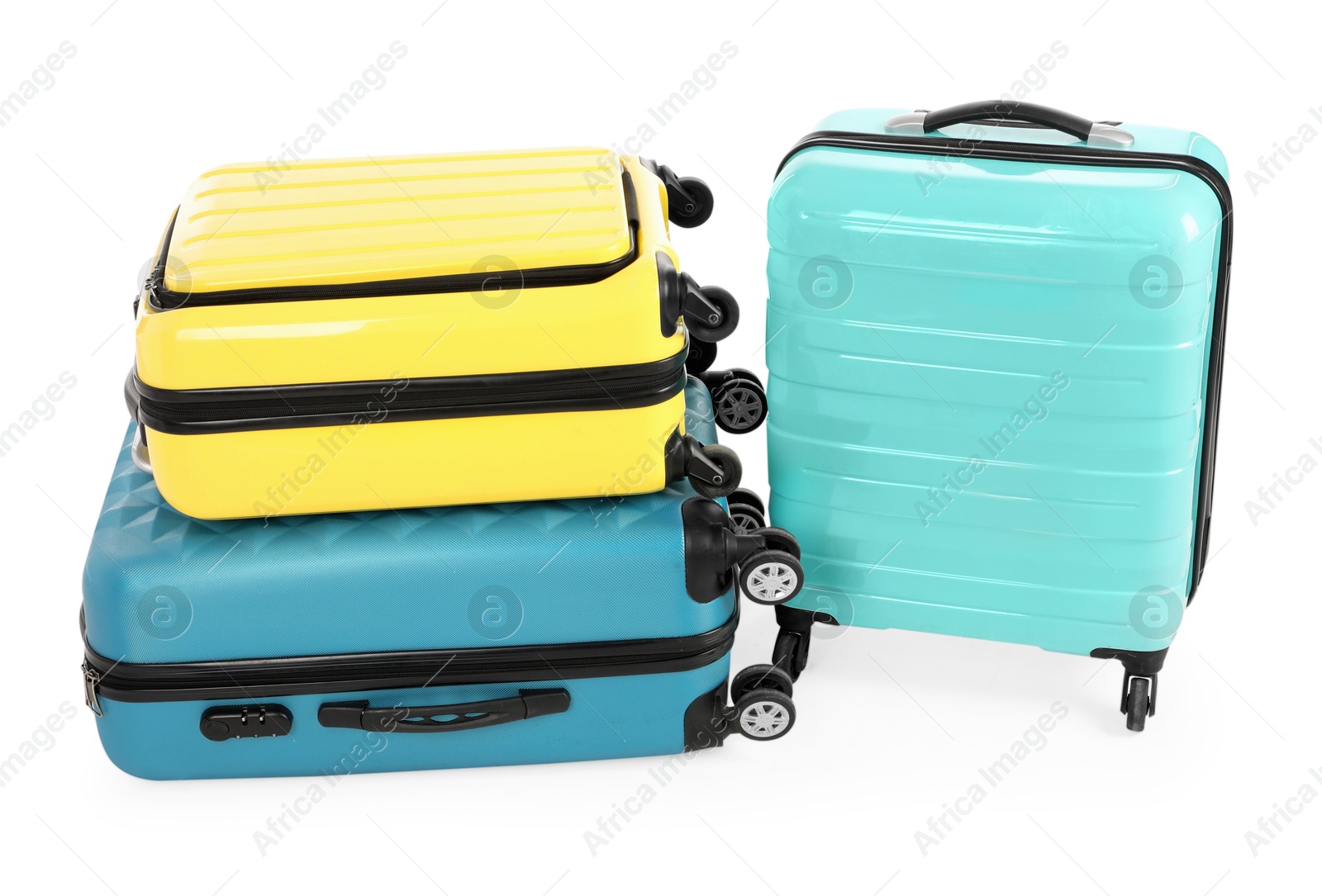 Photo of New yellow and light blue suitcases isolated on white