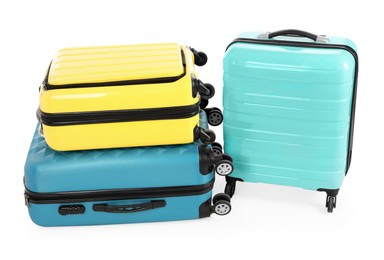 New yellow and light blue suitcases isolated on white