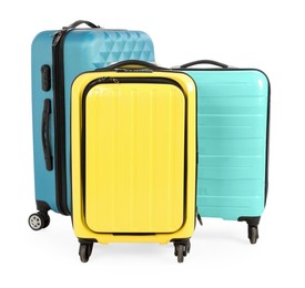 New yellow and light blue suitcases isolated on white