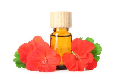 Photo of Bottle of geranium essential oil and beautiful flowers isolated on white