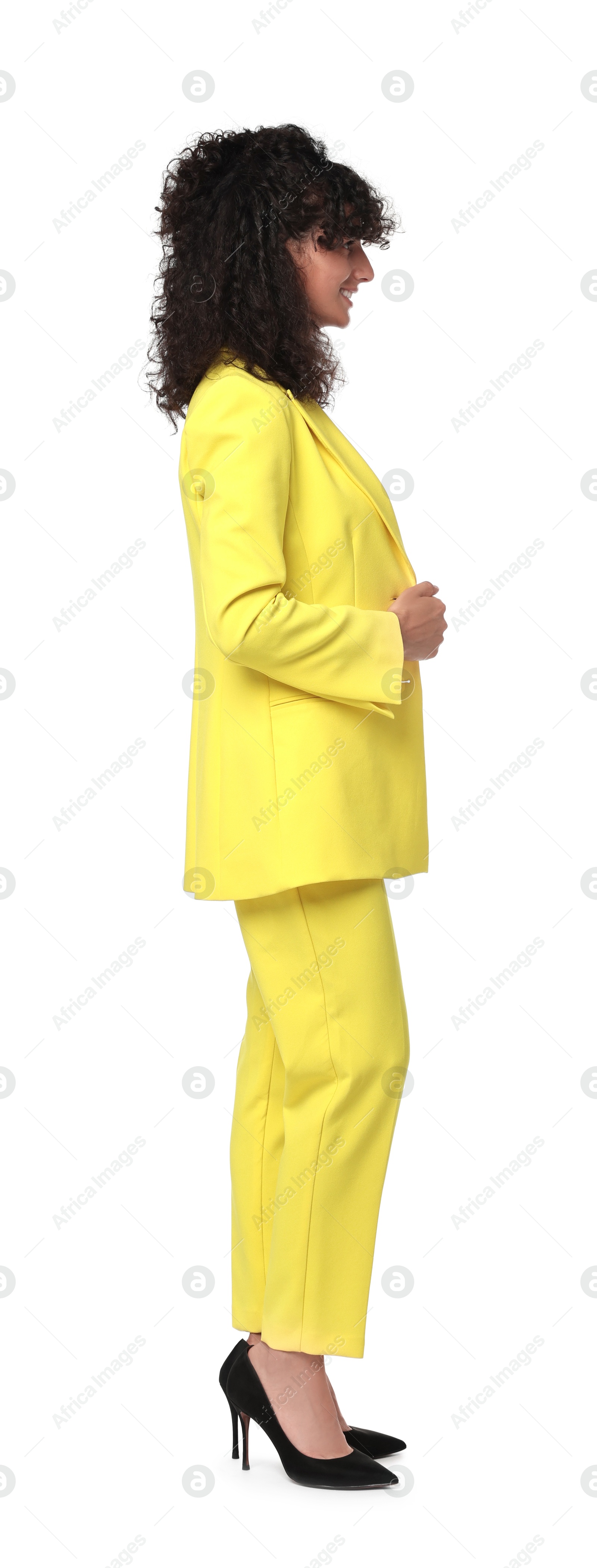 Photo of Beautiful young woman in stylish yellow suit isolated on white