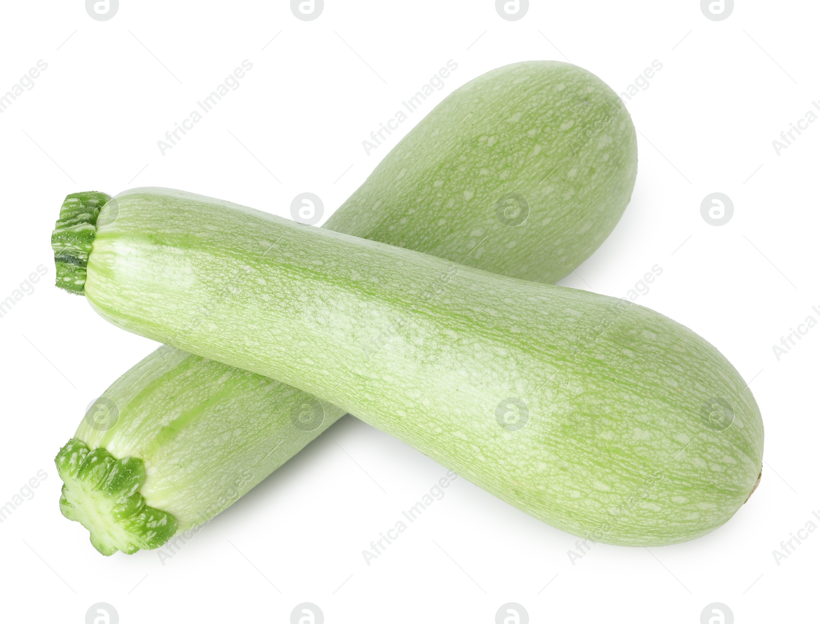 Photo of Two fresh ripe zucchinis isolated on white, above view