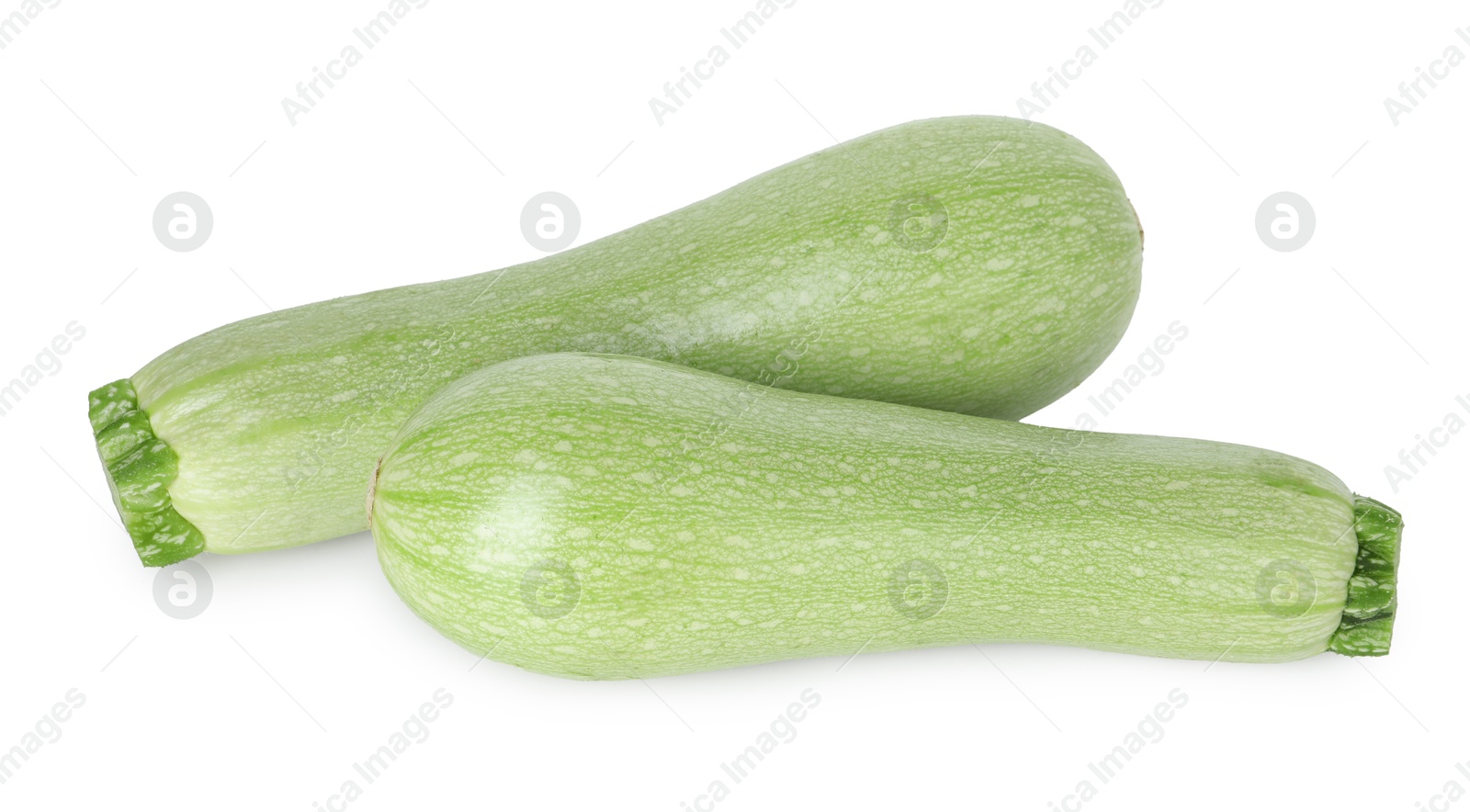 Photo of Two fresh ripe zucchinis isolated on white