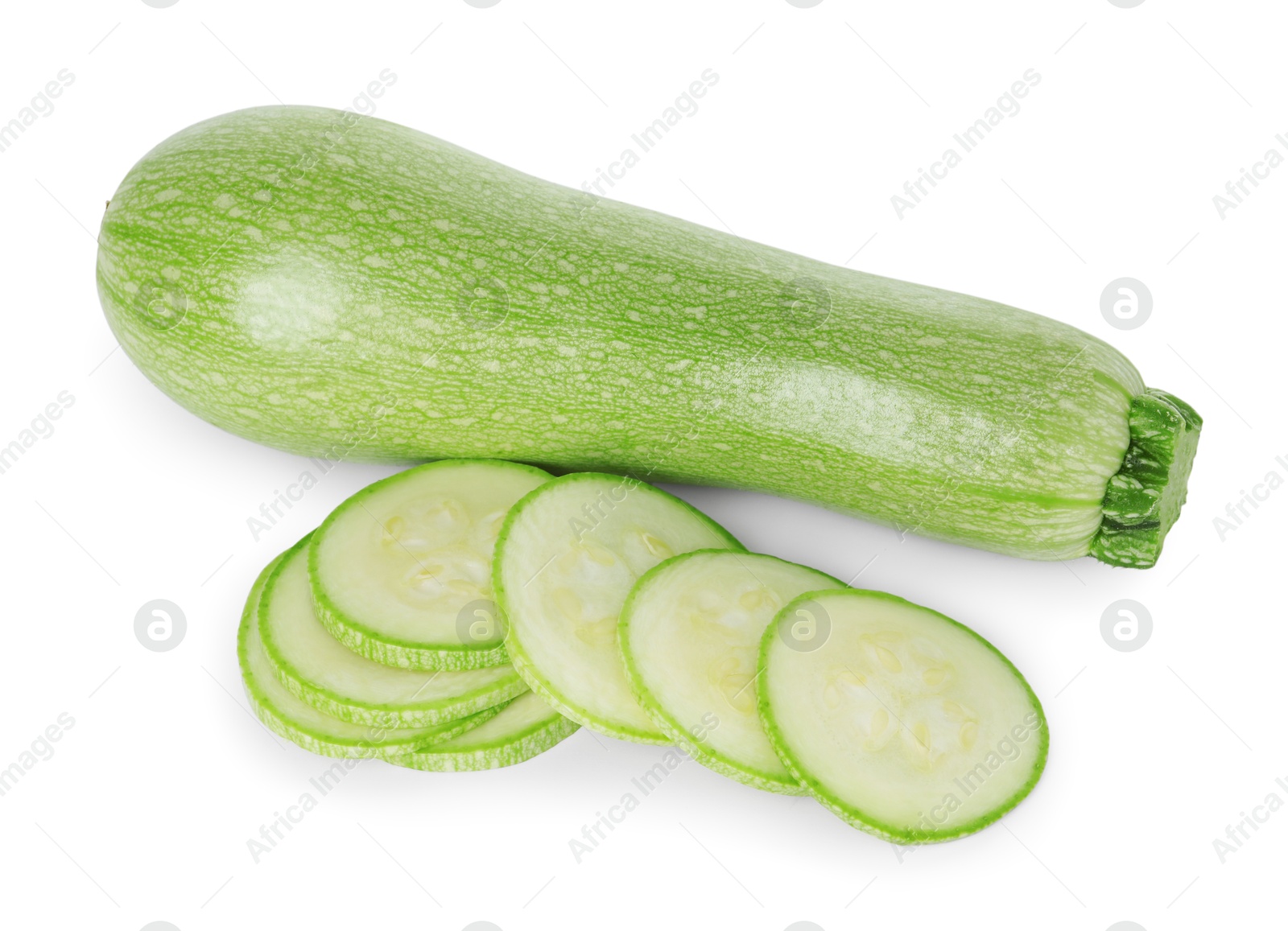 Photo of Fresh whole and cut zucchinis isolated on white, top view