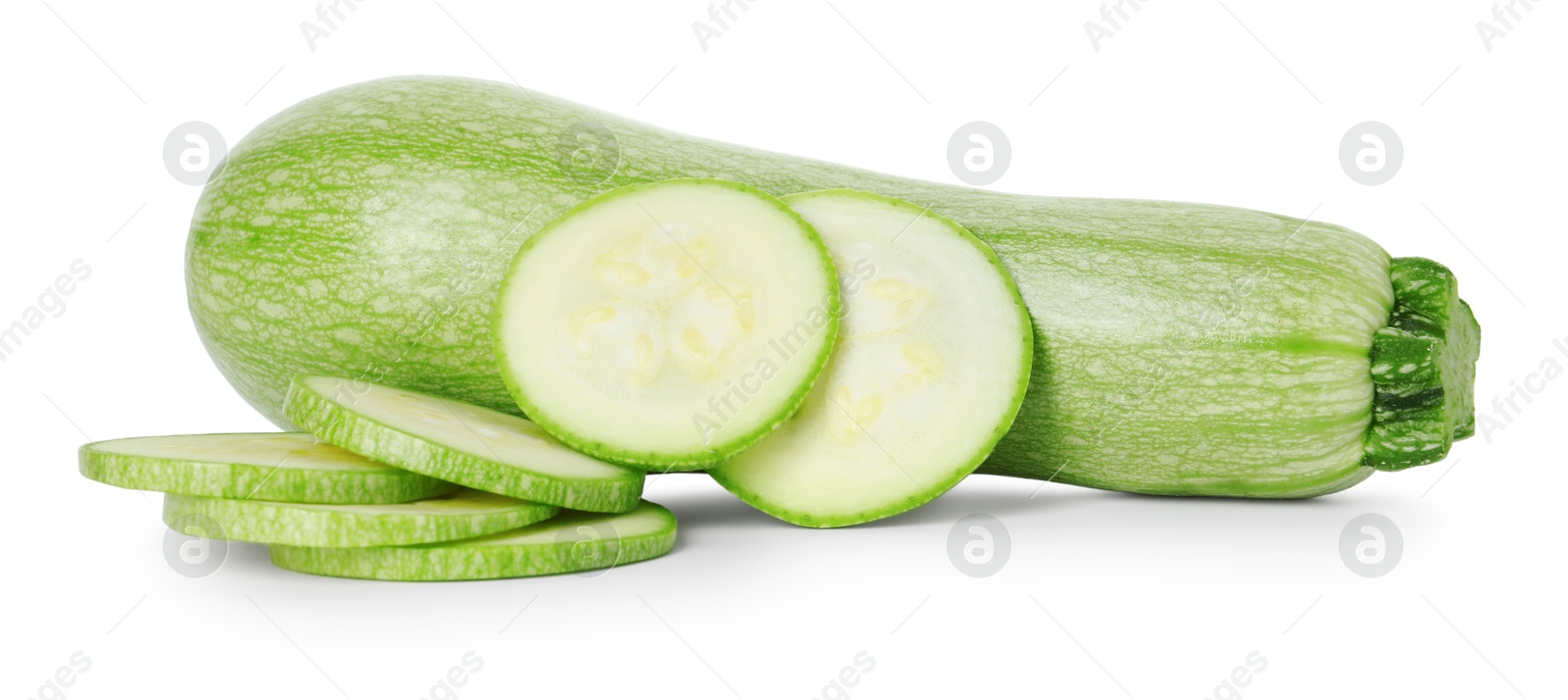 Photo of Fresh whole and cut zucchinis isolated on white